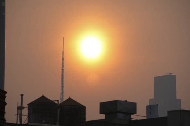 July 18, 2026, New York, New York, USA: The sun rises through the smoke from Canadian Wildfires over Manhattan on July 18, 2026 in New York. More than 200 wildfires are burning in Canada causing smoke to drift across the United States spiking the air quality index. New York USA - ZUMAb148 20260718_zap_b148_018 Copyright: xBryanxSmithx