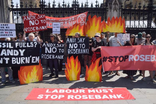 July 18, 2026, London, England, United Kingdom: Activists from Fossil Free London stage a protest outside the parliament calling on incoming Prime Minister Andy Burnham to stop the Rosebank oil and gas field in the North Sea. London United Kingdom - ZUMAv130 20260718_zip_v130_001 Copyright: xVukxValcicx