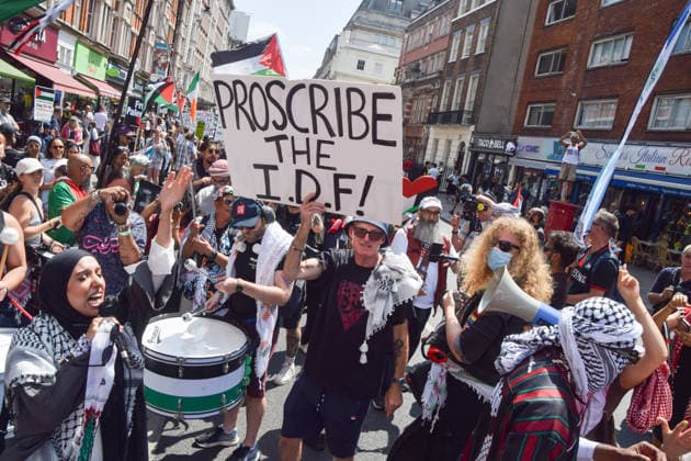 July 18, 2026, London, England, United Kingdom: A protester holds a Proscribe the IDF placard as thousands of people march in support of Palestine. London United Kingdom - ZUMAv130 20260718_zip_v130_030 Copyright: xVukxValcicx
