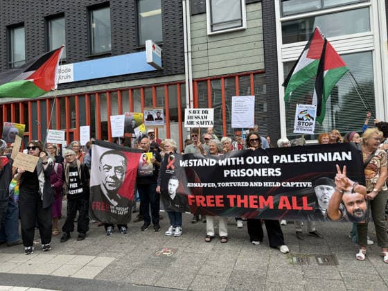 Demonstration in support of Palestine in Amsterdam AMSTERDAM, NETHERLANDS - JULY 18: People gather in front of the Dutch Red Cross (Rode Kruis) to show solidarity with Palestine demanding the release of Dr. Husam Abu Safiya, chief physician of Kamal Adwan Hospital, whose health condition is reportedly worsening while being held in an Israeli prison, and calling on the International Red Cross to visit him, in Amsterdam, the Netherlands on July 18, 2026. Selman Aksunger Anadolu Amsterdam Netherlands. Editorial use only. Please get in touch for any other usage.  Copyright: x2026xAnadoluxSelmanxAksungerx