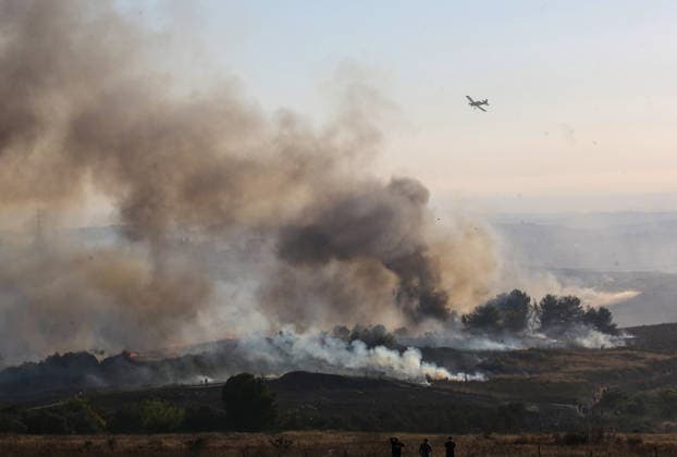 Israeli settlers set fire to Palestinian agricultural lands in Nablus village??????? NABLUS, WEST BANK, PALESTINE - JULY 18: Smoke rise as a large-scale fire burns through Palestinian agricultural lands in the village of Tel, south of Nablus in the West Bank, Palestine on July 18, 2026. A group of Israeli settlers deliberately set fire to the crop fields, forcing local Palestinian landowners to battle the fast-spreading flames with basic tools before emergency fire crews arrived to conduct ground and aerial firefighting operations to contain the blaze. Nedal Eshtayah Anadolu Nablus West Bank. Editorial use only. Please get in touch for any other usage.  Copyright: x2026xAnadoluxNedalxEshtayahx