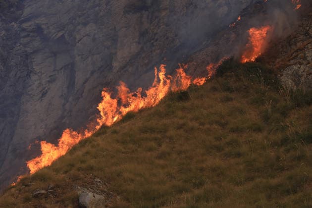 Forest fires continue on the Italian island of Sicily PALERMO, ITALY - JULY 18: Smoke and flames rise from a forest fire spreading across the slopes of Mount Iato near Palermo on the island of Sicily, Italy, on July 18, 2026, as ground and air crews continue their efforts to contain the blaze. Forest fires breaking out at various points on the island are continuing. Alberto Lo Bianco Anadolu Palermo Italy. Editorial use only. Please get in touch for any other usage.  Copyright: x2026xAnadoluxAlbertoxLoxBiancox