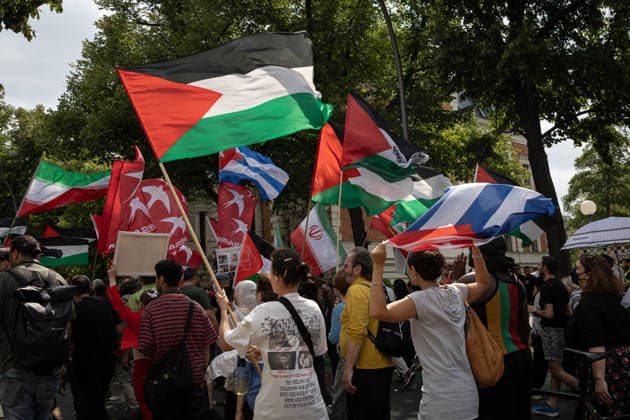 Pro-Palestinian demonstration in Berlin, Germany- 18 Jul 2026 A group of activists marches with flags, including the Cuban flag, during a pro-Palestinian demonstration near Tempelhof Airport. Hundreds of people marched through the city center with drums, some wearing keffiyehs, traditional Palestinian scarves, while calling for an end to the wars in the Gaza Strip and Iran. Berlin Germany Copyright: xVasilyxKrestyaninovx xSOPAxImagesx _VKR5155