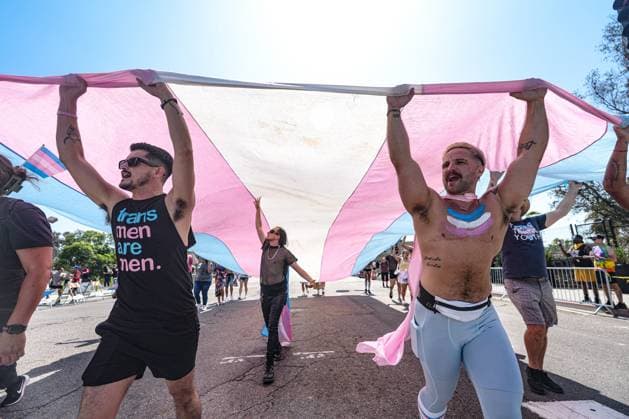 July 18, 2026, San Diego, California, Unted States: People march on the streets with a huge transgender flag during the parade..The 2026 San Diego Pride Parade fills the streets of Hillcrest area with color, energy, and a powerful sense of community as thousands of people gather to celebrate LGBTQ+ pride and equality on July 18th, 2026, in San Diego, California. Participants wave rainbow flags, dance alongside decorated floats, and cheer for local organizations, businesses, and advocacy groups that march through the streets. Allies line the parade route, creating an atmosphere of joy while also recognizing Pride s roots in the fight for equal rights. San Diego Unted States  - ZUMAs197 20260718_aaa_s197_103 Copyright: xWaixLeexMichaelxHox