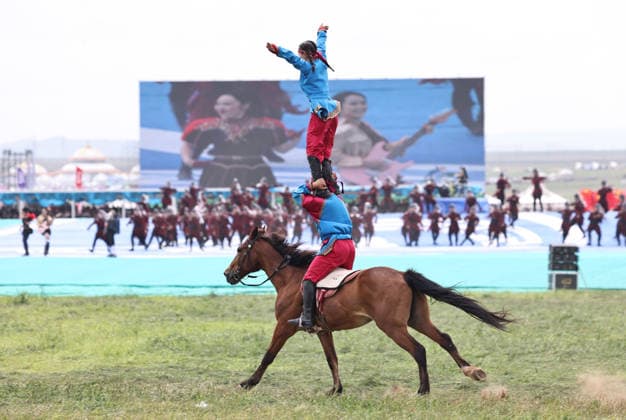 XILINGOL, CHINA - JULY 18: Artists perform on horseback at the opening ceremony of the 36th Naadam festival on July 18, 2026 in Xilingol League, Inner Mongolia Autonomous Region of China. The Naadam festival kicked off here on July 18. Naadam, usually held in mid-summer and sometimes in winter in pastoral areas of Inner Mongolia, means games in the Mongolian language. It often comprises wrestling, archery, and horse racing, also known as the Three Games of Men.  Copyright: xVCGx 111655158205