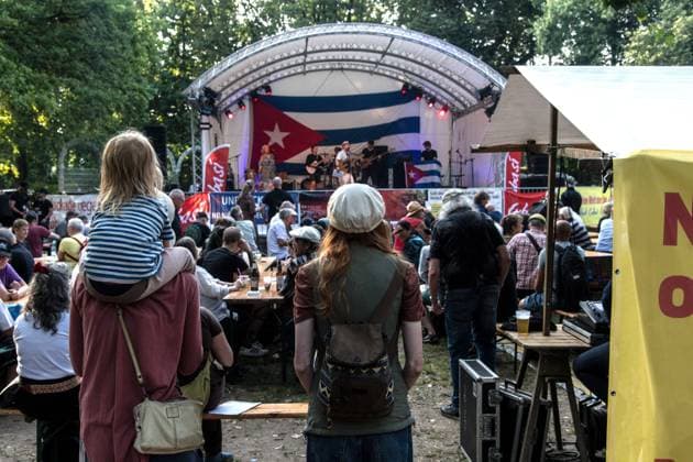 Solidarity Gathering with Cuba Held in Berlin BERLIN, GERMANY JULY 18, 2026: People gather at Stadtpark Lichtenberg under the slogan Learn from Cuba, Fight for Cuba, Celebrate with Cuba during an event expressing solidarity with the Caribbean nation. Participants called for an end to the United States embargo and international sanctions, which organisers said have contributed to decades of economic hardship in Cuba. Berlin Germany Copyright: x xAndrÃ sxTrujillox xJNAxPressx