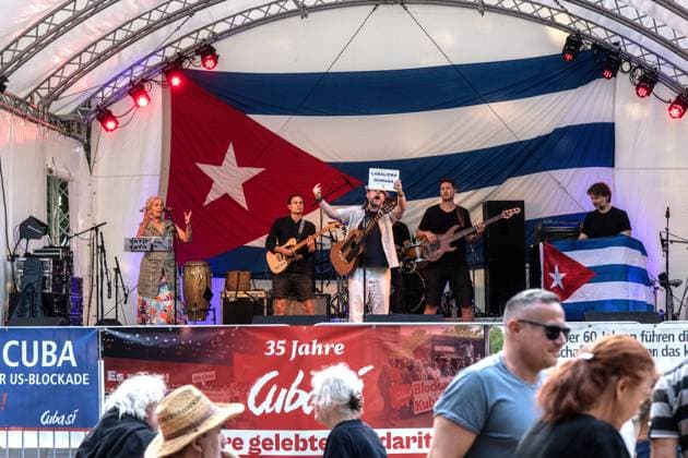 Solidarity Gathering with Cuba Held in Berlin BERLIN, GERMANY JULY 18, 2026: People gather at Stadtpark Lichtenberg under the slogan Learn from Cuba, Fight for Cuba, Celebrate with Cuba during an event expressing solidarity with the Caribbean nation. Participants called for an end to the United States embargo and international sanctions, which organisers said have contributed to decades of economic hardship in Cuba. Berlin Germany Copyright: x xAndrÃ sxTrujillox xJNAxPressx