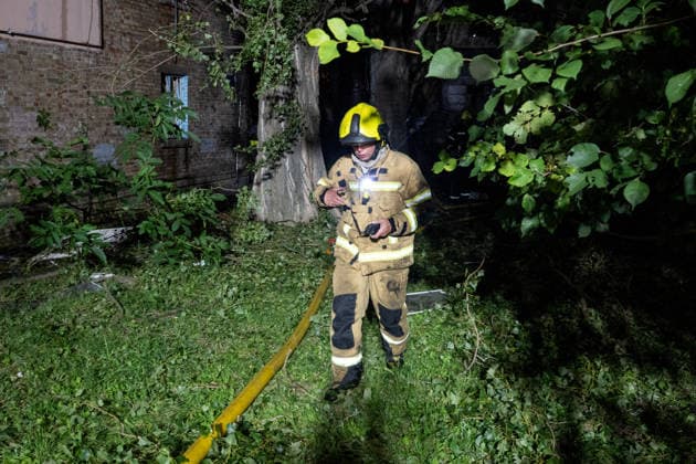 A firefighter works at a five-storey apartment block in the Solomianskyi district damaged by a Russian attack on Kyiv, Ukraine, July 19, 2026. The Russian army launched a massive strike on the Ukrainian capital with ballistic missiles. According to preliminary data from the State Emergency Service of Ukraine, one person was killed and 15 were injured. Falling debris and fires were reported in five districts of the city, while an underpass near the Lukianivska metro station sustained a direct hit. (Photo by Danylo Antoniuk Ukrinform) Russian army attack Kyiv with ballistic missiles  Copyright: xDanyloxAntoniukx