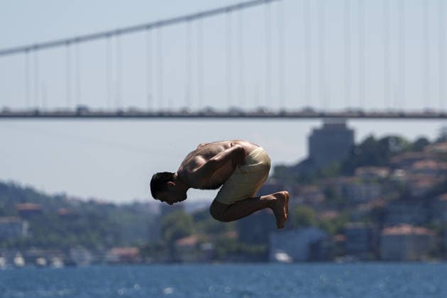 People cool off at Emirgan coast amid summer heatwave in Istanbul ISTANBUL, TURKIYE - JULY 19: People swim and cool off in the waters of the Bosporus at the Emirgan coast in the Sariyer district of Istanbul, Turkiye, on July 19, 2026. Choked by sweltering summer temperatures hitting the city, locals and visitors flocked to the coastal parks and beaches to seek relief from the intense heat wave. Arife Karakum Anadolu Istanbul Turkey. Editorial use only. Please get in touch for any other usage.  Copyright: x2026xAnadoluxArifexKarakumx