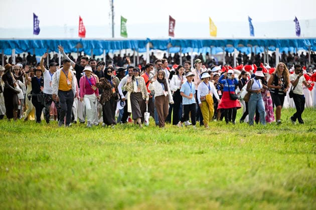 (260718) -- XILIN GOL, July 18, 2026 -- Tourists are pictured at the opening ceremony of the 36th Naadam festival in Xilin Gol League, north China s Inner Mongolia Autonomous Region, July 18, 2026. The Naadam festival kicked off here on Saturday. Naadam, usually held in mid-summer and sometimes in winter in pastoral areas of Inner Mongolia, means games in the Mongolian language. It often comprises wrestling, archery, and horse racing, also known as the Three Games of Men. ) CHINA-INNER MONGOLIA-XILIN GOL-NAADAM FESTIVAL-OPENING (CN) LixZhipeng 