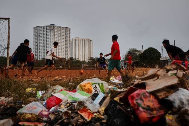 July 19, 2026, Jakarta, Indonesia: JAKARTA, INDONESIA Ã¢â‚¬ JULY 19, 2026: Children sit and play outside a house in Kampung Muara Baru, North Jakarta. According to the Jakarta Public Housing and Settlement Agency (DPRKP), high population density, limited land for infrastructure development, zoning constraints and land tenure issues remain among the main challenges to improving informal settlements in the Indonesian capital. JNA Press Jakarta Indonesia - ZUMAq101 20260719_zna_q101_079 Copyright: xMuhammadxRizkyxFebriansyahx