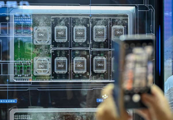(260719) -- SHANGHAI, July 19, 2026 -- A visitor takes photos of the Dawning 8000 (Dengfeng) AI Supercluster of Sugon displayed during the 2026 World AI Conference and High-Level Meeting on Global AI Governance in Shanghai, east China, July 19, 2026. The 2026 World AI Conference (WAIC) and High-Level Meeting on Global AI Governance opened here on Friday. A group of domestic supernode products draw public attentions during the event. ) CHINA-SHANGHAI-WORLD AI CONFERENCE-DOMESTIC AI SUPERNODES (CN) ChenxHaoming 