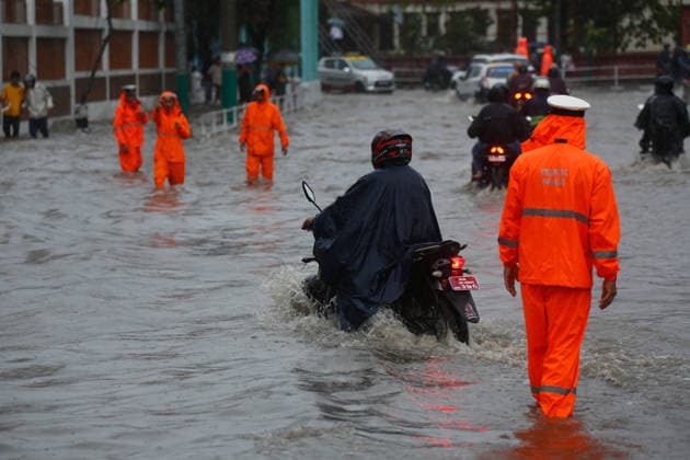 Monsoon Rains Inundate Roads In Central Kathmandu Commuters wade through a waterlogged road after heavy monsoon rainfall inundated the Maitighar Mandala area in Kathmandu, Nepal, on July 19, 2026. Continuous rain caused localized flooding and disrupted traffic and daily life in several parts of the capital, with pedestrians and motorists navigating through floodwaters as the monsoon season continues. Kathmandu Nepal  Copyright: xSanjitxPariyarx originalFilename: pariyar-notitle260719_npjHJ.jpg