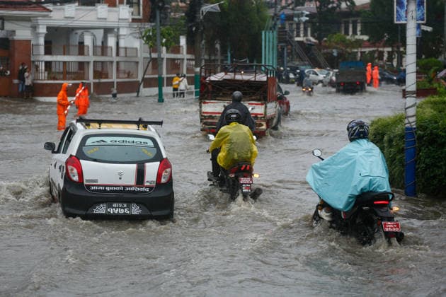 Monsoon Rains Inundate Roads In Central Kathmandu Commuters wade through a waterlogged road after heavy monsoon rainfall inundated the Maitighar Mandala area in Kathmandu, Nepal, on July 19, 2026. Continuous rain caused localized flooding and disrupted traffic and daily life in several parts of the capital, with pedestrians and motorists navigating through floodwaters as the monsoon season continues. Kathmandu Nepal  Copyright: xSanjitxPariyarx originalFilename: pariyar-notitle260719_npR2f.jpg
