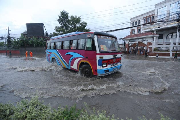 Monsoon Rains Inundate Roads In Central Kathmandu Commuters wade through a waterlogged road after heavy monsoon rainfall inundated the Maitighar Mandala area in Kathmandu, Nepal, on July 19, 2026. Continuous rain caused localized flooding and disrupted traffic and daily life in several parts of the capital, with pedestrians and motorists navigating through floodwaters as the monsoon season continues. Kathmandu Nepal  Copyright: xSanjitxPariyarx originalFilename: pariyar-notitle260719_np9rI.jpg