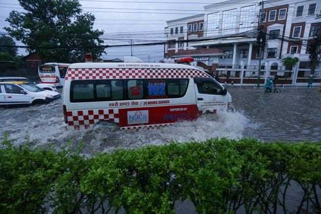 Monsoon Rains Inundate Roads In Central Kathmandu Commuters wade through a waterlogged road after heavy monsoon rainfall inundated the Maitighar Mandala area in Kathmandu, Nepal, on July 19, 2026. Continuous rain caused localized flooding and disrupted traffic and daily life in several parts of the capital, with pedestrians and motorists navigating through floodwaters as the monsoon season continues. Kathmandu Nepal  Copyright: xSanjitxPariyarx originalFilename: pariyar-notitle260719_npBNE.jpg