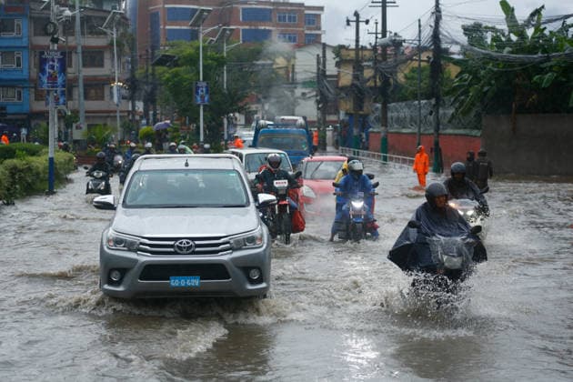 Monsoon Rains Inundate Roads In Central Kathmandu Commuters wade through a waterlogged road after heavy monsoon rainfall inundated the Maitighar Mandala area in Kathmandu, Nepal, on July 19, 2026. Continuous rain caused localized flooding and disrupted traffic and daily life in several parts of the capital, with pedestrians and motorists navigating through floodwaters as the monsoon season continues. Kathmandu Nepal  Copyright: xSanjitxPariyarx originalFilename: pariyar-notitle260719_npysm.jpg