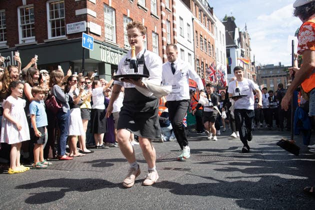 SOHO Waiters Race at SOHO, London, UK - Sun 19 July 2026 Waiters from various London restaurants take part in the annual SOHO Waiters Race, balancing a champagne bottle and a glass around SOHO in London, England, UK on Sunday 19 July 2026 as part of the SOHO Village Fete., Credit:Justin Ng Avalon UK, England, London, SOHO  Copyright: xJustinxNgx xAvalonx 1117372140