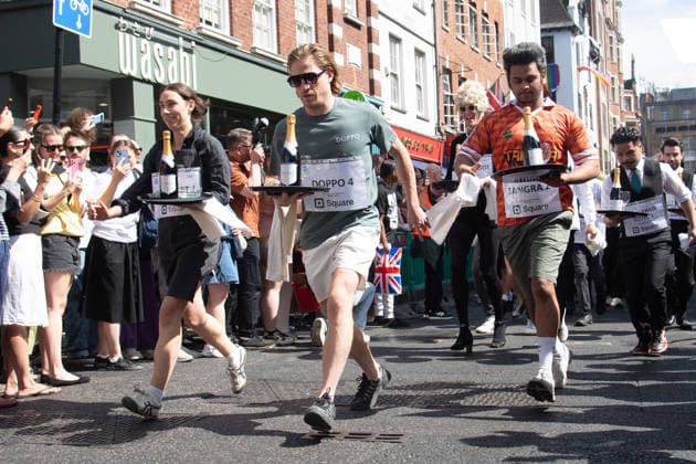 SOHO Waiters Race at SOHO, London, UK - Sun 19 July 2026 Waiters from various London restaurants take part in the annual SOHO Waiters Race, balancing a champagne bottle and a glass around SOHO in London, England, UK on Sunday 19 July 2026 as part of the SOHO Village Fete., Credit:Justin Ng Avalon UK, England, London, SOHO  Copyright: xJustinxNgx xAvalonx 1117372148