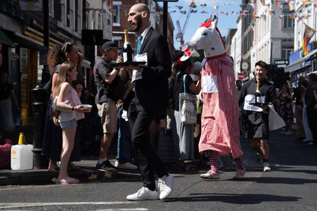 SOHO Waiters Race at SOHO, London, UK - Sun 19 July 2026 Waiters from various London restaurants take part in the annual SOHO Waiters Race, balancing a champagne bottle and a glass around SOHO in London, England, UK on Sunday 19 July 2026 as part of the SOHO Village Fete., Credit:Justin Ng Avalon UK, England, London, SOHO  Copyright: xJustinxNgx xAvalonx 1117372180