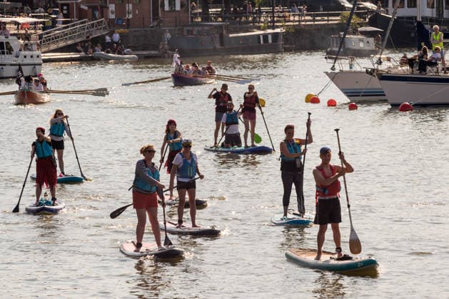 July 19, 2026, Bristol, Bristol, UK: Bristol, UK. Stand up paddle boarders take part in the boat parade at Bristol Harbour Festival in warm weather at the end of the latest summer heatwave in the UK. The event includes maritime displays and boats and ships with music, circus and other performances. Bristol UK  - ZUMAl94_ 20260719_zaf_l94_019 Copyright: xSimonxChapmanx