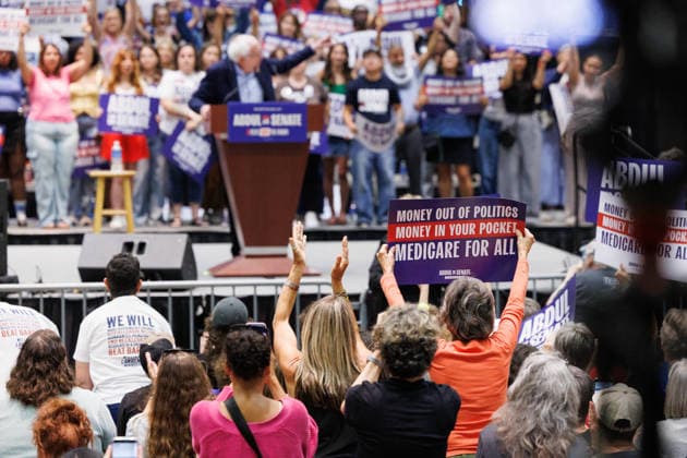 July 19, 2026, Lansing, Michigan, USA: Supporters of U.S. Senate candidate Abdul El-Sayed hold up signs during a rally with U.S. Sen. Bernie Sanders and U.S. Rep. Alexandria Ocasio-Cortez in Lansing, Mich., on July 19, 2026. Lansing USA  - ZUMAr192 20260719_znp_r192_017 Copyright: xAndrewxRothx