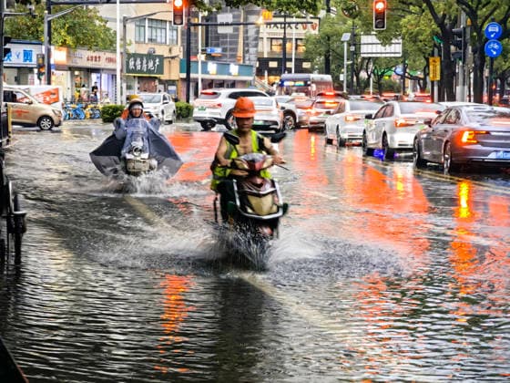 SHANGHAI, CHINA - JULY 19: Motorcyclists drive through flooded street due to heavy rainstorms on July 19, 2026 in Shanghai, China. Heavy rain caused severe waterlogging in roads and residential areas in Shanghai s Yangpu District. Shanghai Meteorological Observatory upgraded the rainstorm alert from yellow to orange for the central urban area at 14:35 on July 19.  Copyright: xVCGx 111655264437