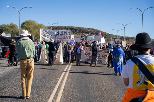 CLOSE PINE GAP PROTEST ALICE SPRINGS, Hundreds of protesters convoy during the three-day Close Pine Gap symposium in Alice Springs, Northern Territory, Monday, July 20, 2026. Those gathered are calling for the closure of the US military intelligence base Pine Gap, for an end to the US alliance, and for the sacred land the base occupies to be returned to Arrernte custodians, who never consented to the base. ( NO ARCHIVING ALICE SPRINGS NORTHERN TERRITORY AUSTRALIA  Copyright: xRHETTxHAMMERTONx 20260720133121415993