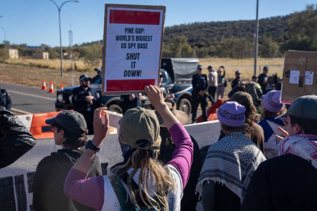 CLOSE PINE GAP PROTEST ALICE SPRINGS, Hundreds of protesters convoy during the three-day Close Pine Gap symposium in Alice Springs, Northern Territory, Monday, July 20, 2026. Those gathered are calling for the closure of the US military intelligence base Pine Gap, for an end to the US alliance, and for the sacred land the base occupies to be returned to Arrernte custodians, who never consented to the base. ( NO ARCHIVING ALICE SPRINGS NORTHERN TERRITORY AUSTRALIA  Copyright: xRHETTxHAMMERTONx 20260720145055077402
