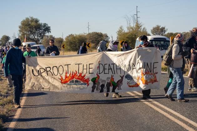 CLOSE PINE GAP PROTEST ALICE SPRINGS, Hundreds of protesters convoy during the three-day Close Pine Gap symposium in Alice Springs, Northern Territory, Monday, July 20, 2026. Those gathered are calling for the closure of the US military intelligence base Pine Gap, for an end to the US alliance, and for the sacred land the base occupies to be returned to Arrernte custodians, who never consented to the base. ( NO ARCHIVING ALICE SPRINGS NORTHERN TERRITORY AUSTRALIA  Copyright: xRHETTxHAMMERTONx 20260720194457305345