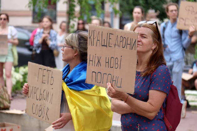 Demonstrators hold placards during a protest action against the dismissal of Ukrainian Defence Minister Mykhailo Fedorov in Ivana Franka Square outside the Ivan Franko National Academic Drama Theatre and near the Office of the President, Kyiv, Ukraine, July 19, 2026. (Photo by Pavlo Bahmut Ukrinform) Day Four of protest action against dismissal of Mykhailo Fedorov in Kyiv  Copyright: xPavloxBahmutx