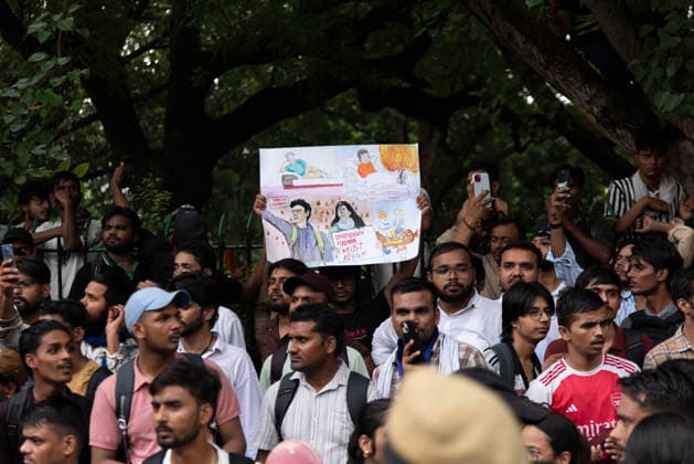 July 20, 2026, New Delhi, Delhi, India: Supporters of India s Cockroach Janta Party (CJP) gather before a march to Parliament during a protest demanding the resignation of Education Minister Dharmendra Pradhan over alleged exam paper leaks. Members of the Rapid Action Force (RAF) are deployed at the protest site near Jantar Mantar in New Delhi, India. New Delhi India  - ZUMAt180 20260720_zip_t180_010 Copyright: xJaixThakurx