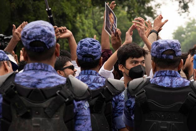 July 20, 2026, New Delhi, Delhi, India: Supporters of India s Cockroach Janta Party (CJP) gather before a march to Parliament during a protest demanding the resignation of Education Minister Dharmendra Pradhan over alleged exam paper leaks. Members of the Rapid Action Force (RAF) are deployed at the protest site near Jantar Mantar in New Delhi, India. New Delhi India  - ZUMAt180 20260720_zip_t180_013 Copyright: xJaixThakurx