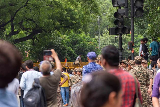 July 20, 2026, New Delhi, Delhi, India: Supporters of India s Cockroach Janta Party (CJP) gather before a march to Parliament during a protest demanding the resignation of Education Minister Dharmendra Pradhan over alleged exam paper leaks. Members of the Rapid Action Force (RAF) are deployed at the protest site near Jantar Mantar in New Delhi, India. New Delhi India  - ZUMAt180 20260720_zip_t180_016 Copyright: xJaixThakurx