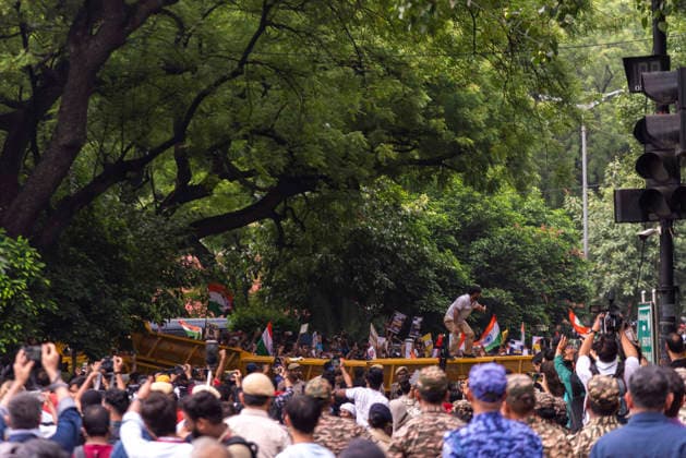 July 20, 2026, New Delhi, Delhi, India: Supporters of India s Cockroach Janta Party (CJP) gather before a march to Parliament during a protest demanding the resignation of Education Minister Dharmendra Pradhan over alleged exam paper leaks. Members of the Rapid Action Force (RAF) are deployed at the protest site near Jantar Mantar in New Delhi, India. New Delhi India  - ZUMAt180 20260720_zip_t180_019 Copyright: xJaixThakurx