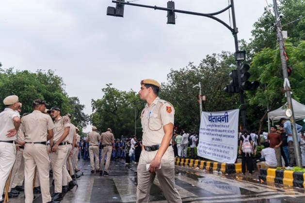 July 20, 2026, New Delhi, Delhi, India: Supporters of India s Cockroach Janta Party (CJP) gather before a march to Parliament during a protest demanding the resignation of Education Minister Dharmendra Pradhan over alleged exam paper leaks. Members of the Rapid Action Force (RAF) are deployed at the protest site near Jantar Mantar in New Delhi, India. New Delhi India - ZUMAt180 20260720_zip_t180_002 Copyright: xJaixThakurx