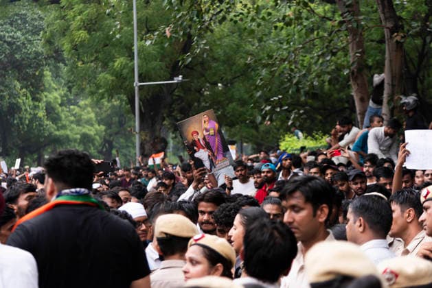 July 20, 2026, New Delhi, Delhi, India: Supporters of India s Cockroach Janta Party (CJP) gather before a march to Parliament during a protest demanding the resignation of Education Minister Dharmendra Pradhan over alleged exam paper leaks. Members of the Rapid Action Force (RAF) are deployed at the protest site near Jantar Mantar in New Delhi, India. New Delhi India - ZUMAt180 20260720_zip_t180_005 Copyright: xJaixThakurx