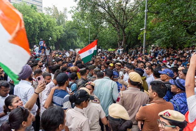 July 20, 2026, New Delhi, Delhi, India: Supporters of India s Cockroach Janta Party (CJP) gather before a march to Parliament during a protest demanding the resignation of Education Minister Dharmendra Pradhan over alleged exam paper leaks. Members of the Rapid Action Force (RAF) are deployed at the protest site near Jantar Mantar in New Delhi, India. New Delhi India - ZUMAt180 20260720_zip_t180_004 Copyright: xJaixThakurx