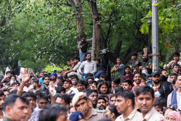 July 20, 2026, New Delhi, Delhi, India: Supporters of India s Cockroach Janta Party (CJP) gather before a march to Parliament during a protest demanding the resignation of Education Minister Dharmendra Pradhan over alleged exam paper leaks. Members of the Rapid Action Force (RAF) are deployed at the protest site near Jantar Mantar in New Delhi, India. New Delhi India - ZUMAt180 20260720_zip_t180_007 Copyright: xJaixThakurx