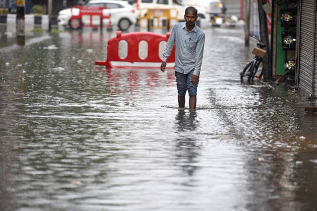 July 20, 2026, Srinagar, Jammu And Kashmir, India: A man wades through a waterlogged street following heavy monsoon rainfall in Srinagar.Torrential rain unleashed flash floods and landslides in Pir Panjal region of J&Ks Poonch and Rajouri districts Sunday, killing at least 14 people, leaving several missing and burying homes under walls of water, rock and mud that barrelled down mountain slopes. Officials said the toll could rise as rescuers searched for those trapped beneath debris. Srinagar India  - ZUMAz120 20260720_zip_z120_004 Copyright: xBasitxZargarx