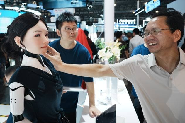 2026 WAIC Held in Shanghai Viewers touch the biomimetic skin of a beautiful robot at the 2026 World Artificial Intelligence Conference in Shanghai, China on July 20, 2026. Shanghai Shanghai China  Copyright: xCFOTOx i1784570728008
