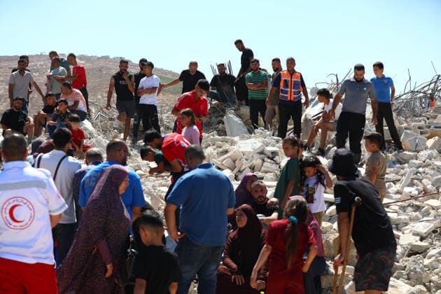 Israeli forces demolish Palestinian home in West Bank HEBRON, PALESTINE - JULY 20: Palestinians gather on the rubble of a house after Israeli forces demolished the home of Palestinian Ahmed Masalmeh in Beit Awwa, Hebron, West Bank, on July 20, 2026. The house was demolished on the grounds that it had been built without a permit. Palestinians mourned as they gathered on the debris following the demolition. Wisam Hashlamoun Anadolu Hebron West Bank. Editorial use only. Please get in touch for any other usage.  Copyright: x2026xAnadoluxWisamxHashlamounx