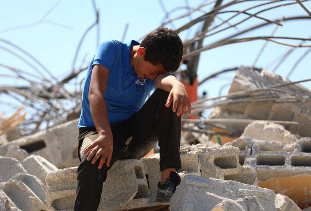 Israeli forces demolish Palestinian home in West Bank HEBRON, PALESTINE - JULY 20: Grieving Palestinian child reacts on the rubble after Israeli forces demolished the home of Palestinian Ahmed Masalmeh in Beit Awwa, Hebron, West Bank, on July 20, 2026. The house was demolished on the grounds that it had been built without a permit. Palestinians gathered at the demolished home in the aftermath of the operation. Wisam Hashlamoun Anadolu Hebron West Bank. Editorial use only. Please get in touch for any other usage.  Copyright: x2026xAnadoluxWisamxHashlamounx