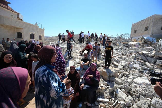 Israeli forces demolish Palestinian home in West Bank HEBRON, PALESTINE - JULY 20: Palestinians gather on the rubble after Israeli forces demolished the home of Palestinian Ahmed Masalmeh in the town of Beit Awwa, west of Hebron in the occupied West Bank, on July 20, 2026. The house was demolished on the grounds that it had been built without a permit. Residents mourned and inspected the debris following the demolition. Wisam Hashlamoun Anadolu Hebron West Bank. Editorial use only. Please get in touch for any other usage.  Copyright: x2026xAnadoluxWisamxHashlamounx