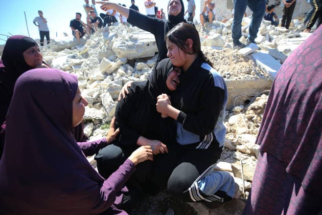 Israeli forces demolish Palestinian home in West Bank HEBRON, PALESTINE - JULY 20: Grieving Palestinians comfort one another on the rubble after Israeli forces demolished the home of Palestinian Ahmed Masalmeh in Beit Awwa, Hebron, West Bank, on July 20, 2026. The house was demolished on the grounds that it had been built without a permit. Palestinians gathered at the demolished home in the aftermath of the operation. Wisam Hashlamoun Anadolu Hebron West Bank. Editorial use only. Please get in touch for any other usage.  Copyright: x2026xAnadoluxWisamxHashlamounx