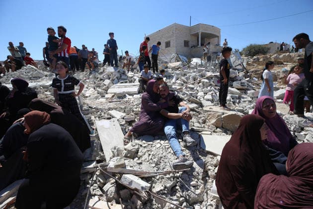 Israeli forces demolish Palestinian home in West Bank HEBRON, PALESTINE - JULY 20: Grieving Palestinians comfort one another on the rubble after Israeli forces demolished the home of Palestinian Ahmed Masalmeh in Beit Awwa, Hebron, West Bank, on July 20, 2026. The house was demolished on the grounds that it had been built without a permit. Palestinians gathered at the demolished home in the aftermath of the operation. Wisam Hashlamoun Anadolu Hebron West Bank. Editorial use only. Please get in touch for any other usage.  Copyright: x2026xAnadoluxWisamxHashlamounx