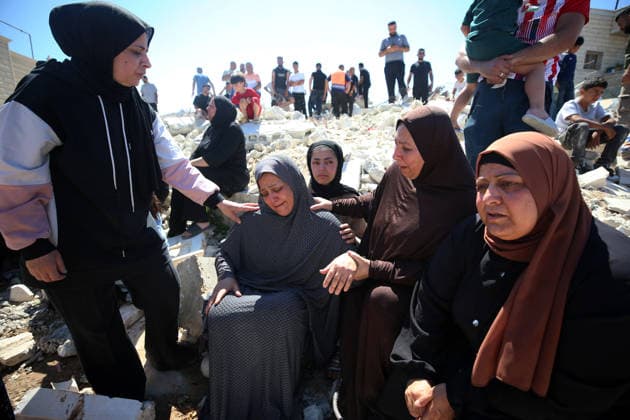 Israeli forces demolish Palestinian home in West Bank HEBRON, PALESTINE - JULY 20: Grieving Palestinians comfort one another on the rubble after Israeli forces demolished the home of Palestinian Ahmed Masalmeh in Beit Awwa, Hebron, West Bank, on July 20, 2026. The house was demolished on the grounds that it had been built without a permit. Palestinians gathered at the demolished home in the aftermath of the operation. Wisam Hashlamoun Anadolu Hebron West Bank. Editorial use only. Please get in touch for any other usage.  Copyright: x2026xAnadoluxWisamxHashlamounx