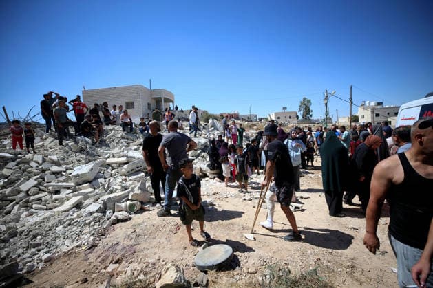 Israeli forces demolish Palestinian home in West Bank HEBRON, PALESTINE - JULY 20: Palestinians gather on the rubble after Israeli forces demolished the home of Palestinian Ahmed Masalmeh in the town of Beit Awwa, west of Hebron in the occupied West Bank, on July 20, 2026. The house was demolished on the grounds that it had been built without a permit. Residents mourned and inspected the debris following the demolition. Wisam Hashlamoun Anadolu Hebron West Bank. Editorial use only. Please get in touch for any other usage.  Copyright: x2026xAnadoluxWisamxHashlamounx