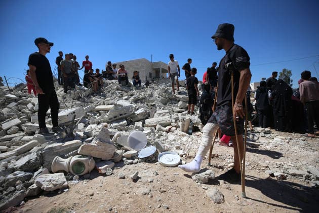 Israeli forces demolish Palestinian home in West Bank HEBRON, PALESTINE - JULY 20: Palestinians gather on the rubble after Israeli forces demolished the home of Palestinian Ahmed Masalmeh in the town of Beit Awwa, west of Hebron in the occupied West Bank, on July 20, 2026. The house was demolished on the grounds that it had been built without a permit. Residents mourned and inspected the debris following the demolition. Wisam Hashlamoun Anadolu Hebron West Bank. Editorial use only. Please get in touch for any other usage.  Copyright: x2026xAnadoluxWisamxHashlamounx