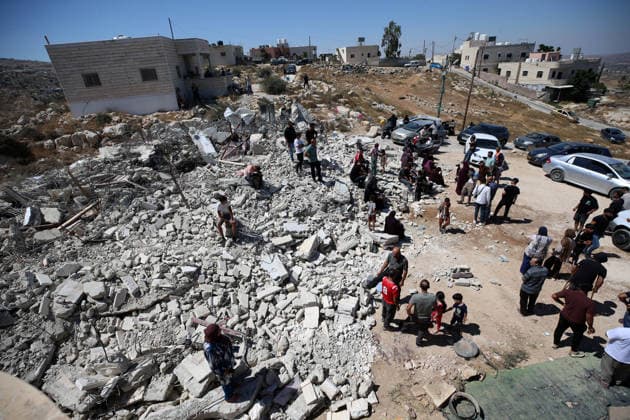 Israeli forces demolish Palestinian home in West Bank HEBRON, PALESTINE - JULY 20: Palestinians gather on the rubble after Israeli forces demolished the home of Palestinian Ahmed Masalmeh in the town of Beit Awwa, west of Hebron in the occupied West Bank, on July 20, 2026. The house was demolished on the grounds that it had been built without a permit. Residents mourned and inspected the debris following the demolition. Wisam Hashlamoun Anadolu Hebron West Bank. Editorial use only. Please get in touch for any other usage.  Copyright: x2026xAnadoluxWisamxHashlamounx